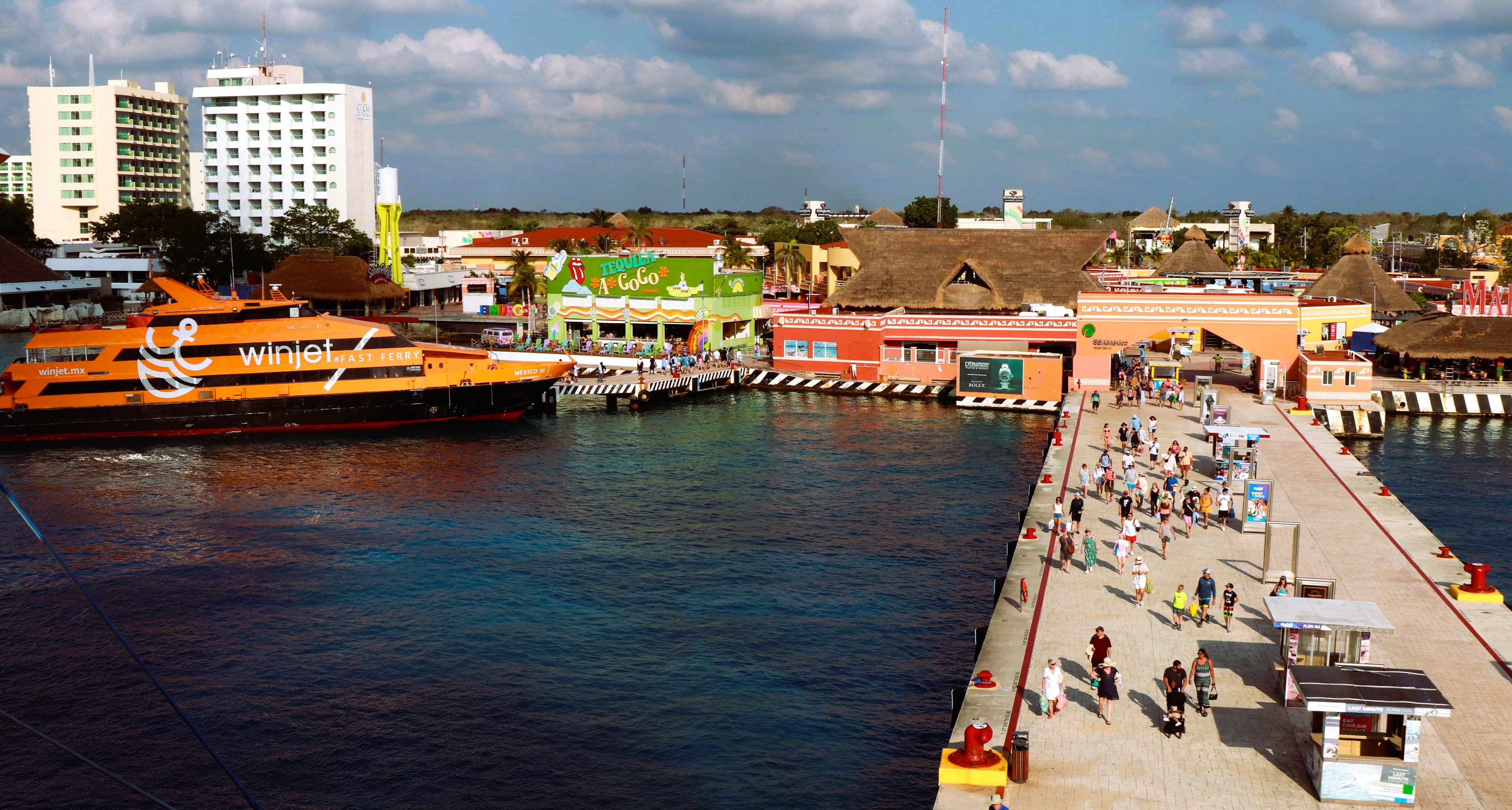 The downtown waterfront and a pier in San Miguel de Cozumel, with a ferry alongside
