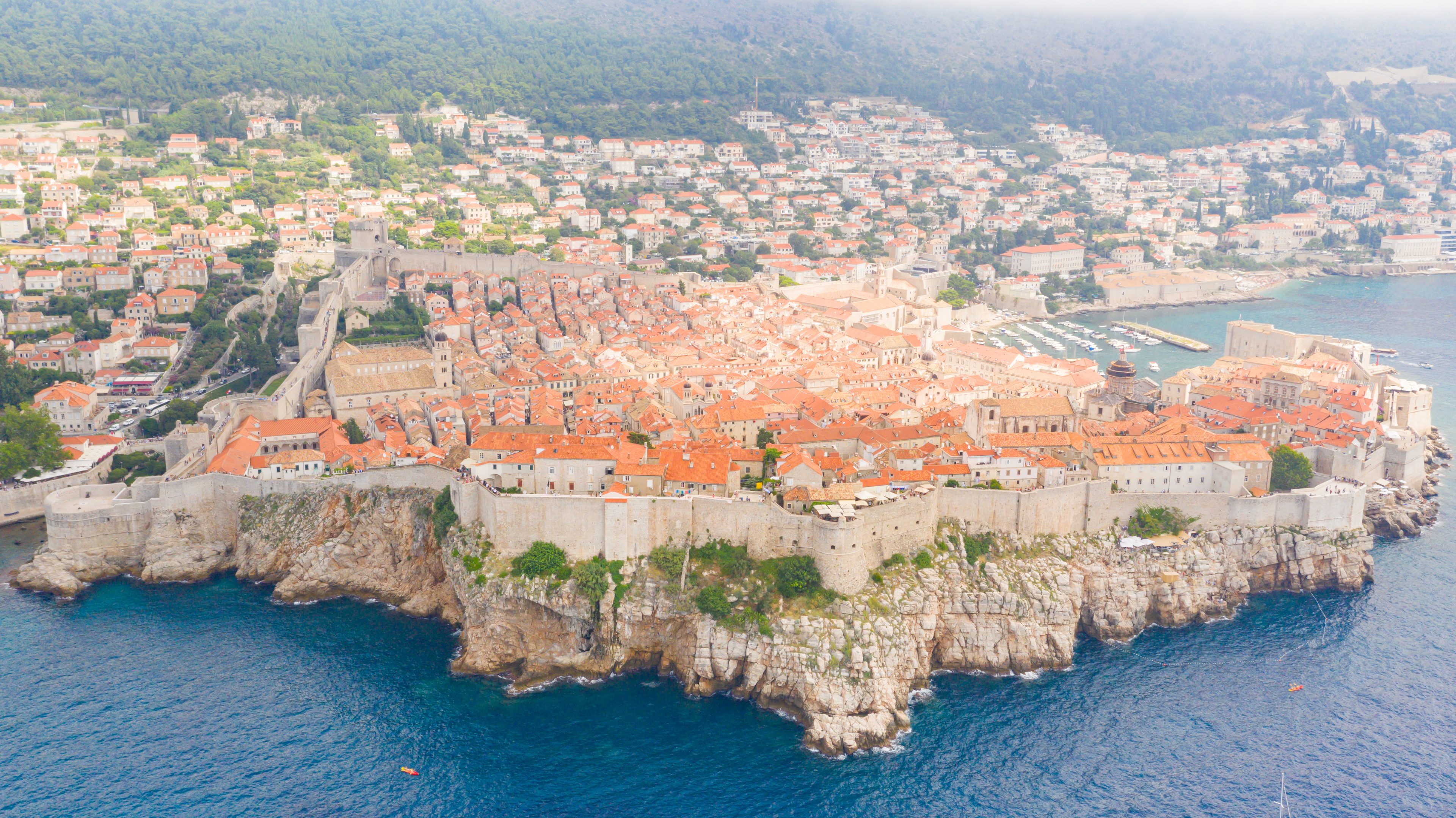Aerial view of Dubrovnik's Old Town, its city walls and the sea below them