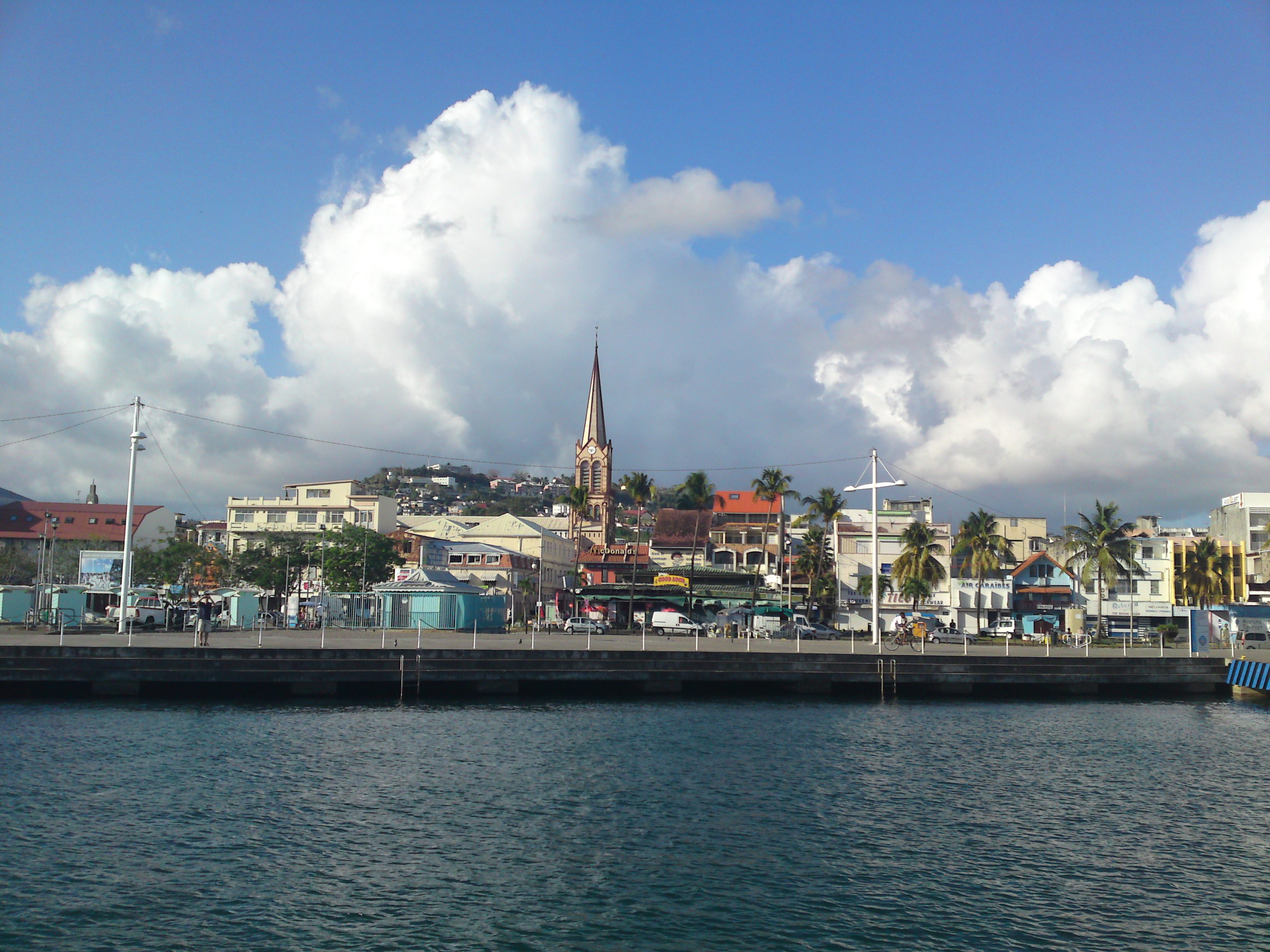 Fort de France and the cathedral spire seen across the bay from the water