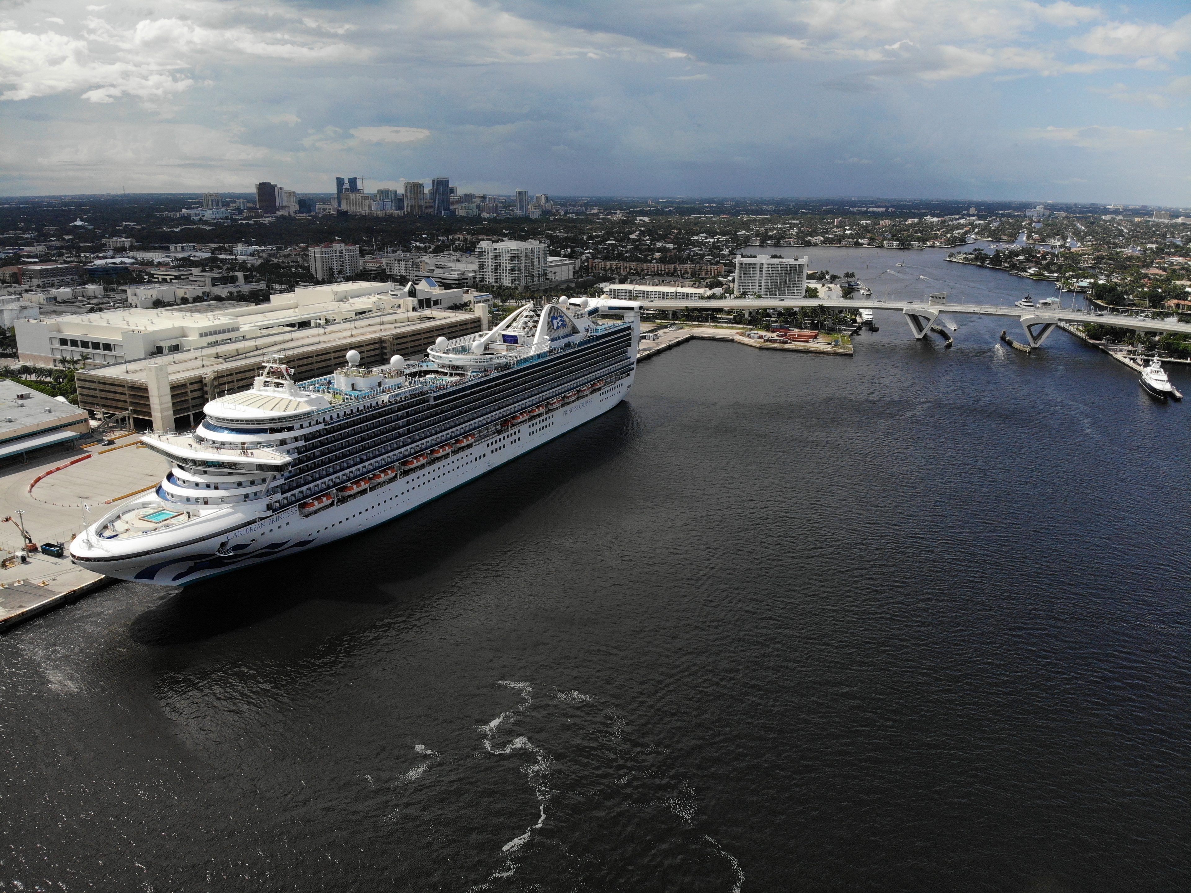 Aerial view of the Caribbean Princess docked at Port Everglades with the Fort Lauderdale skyline behind