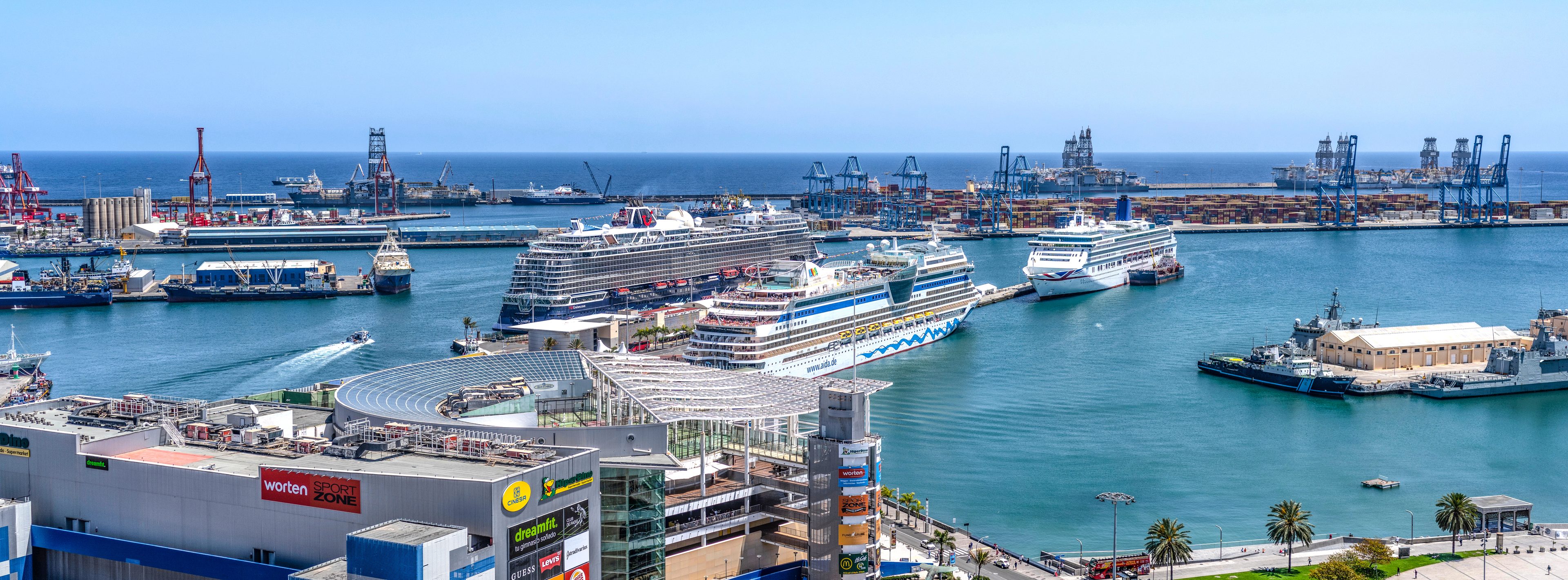Cruise ships at the Santa Catalina pier in Las Palmas, with the port cranes behind