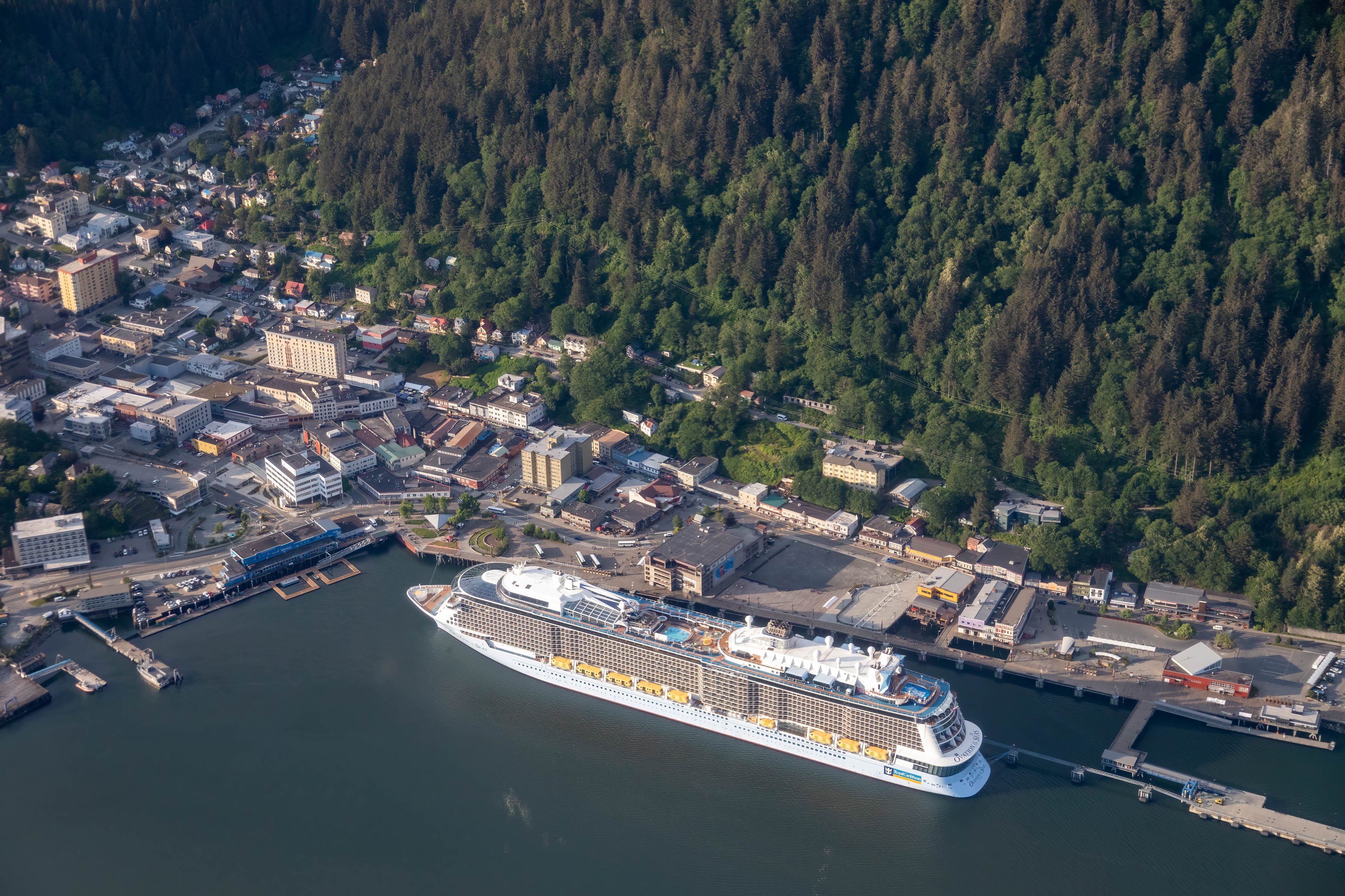 Downtown Juneau from the air, with a large cruise ship at the dock