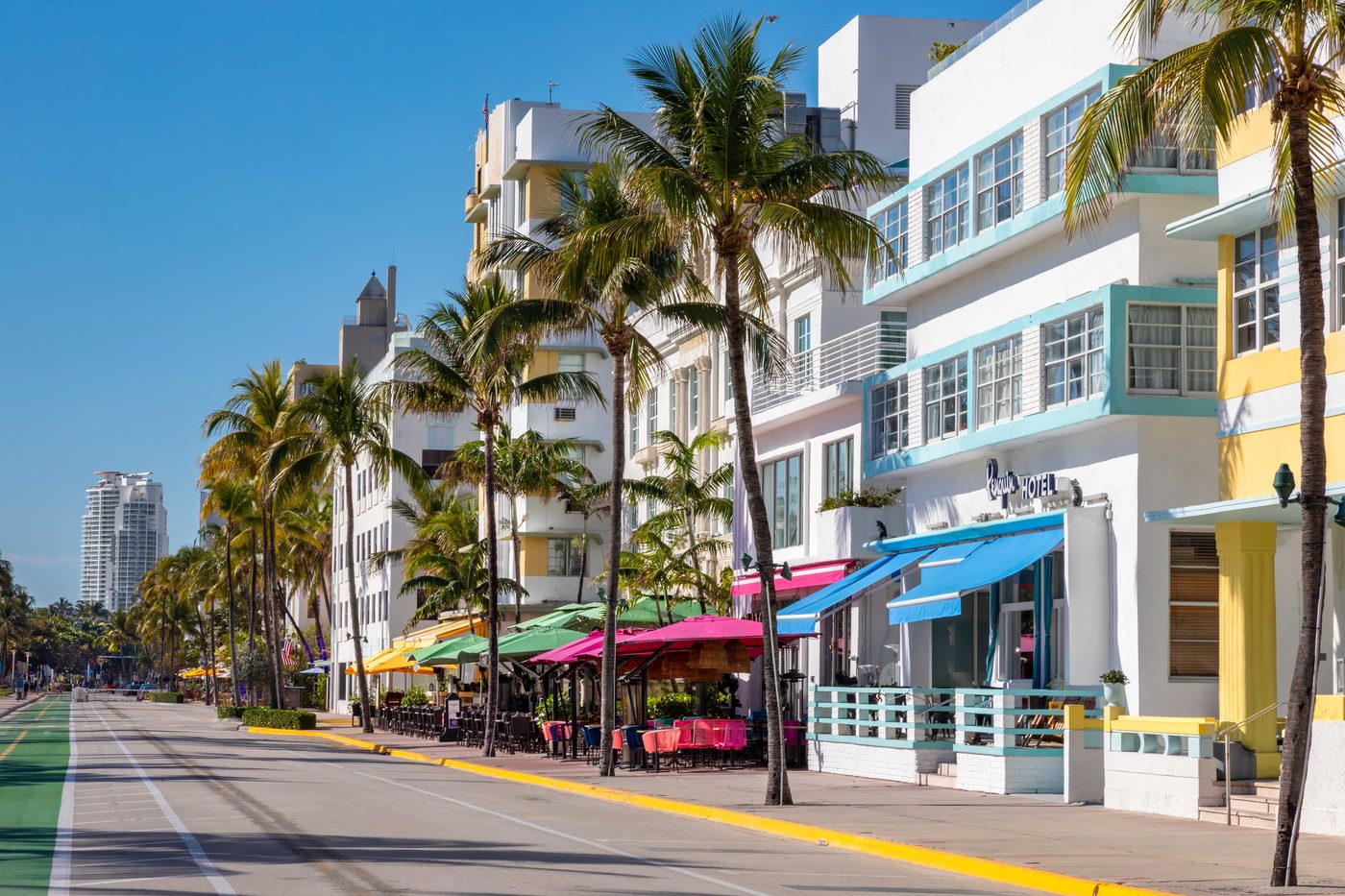 Pastel Art Deco hotels and palm trees along Ocean Drive in South Beach