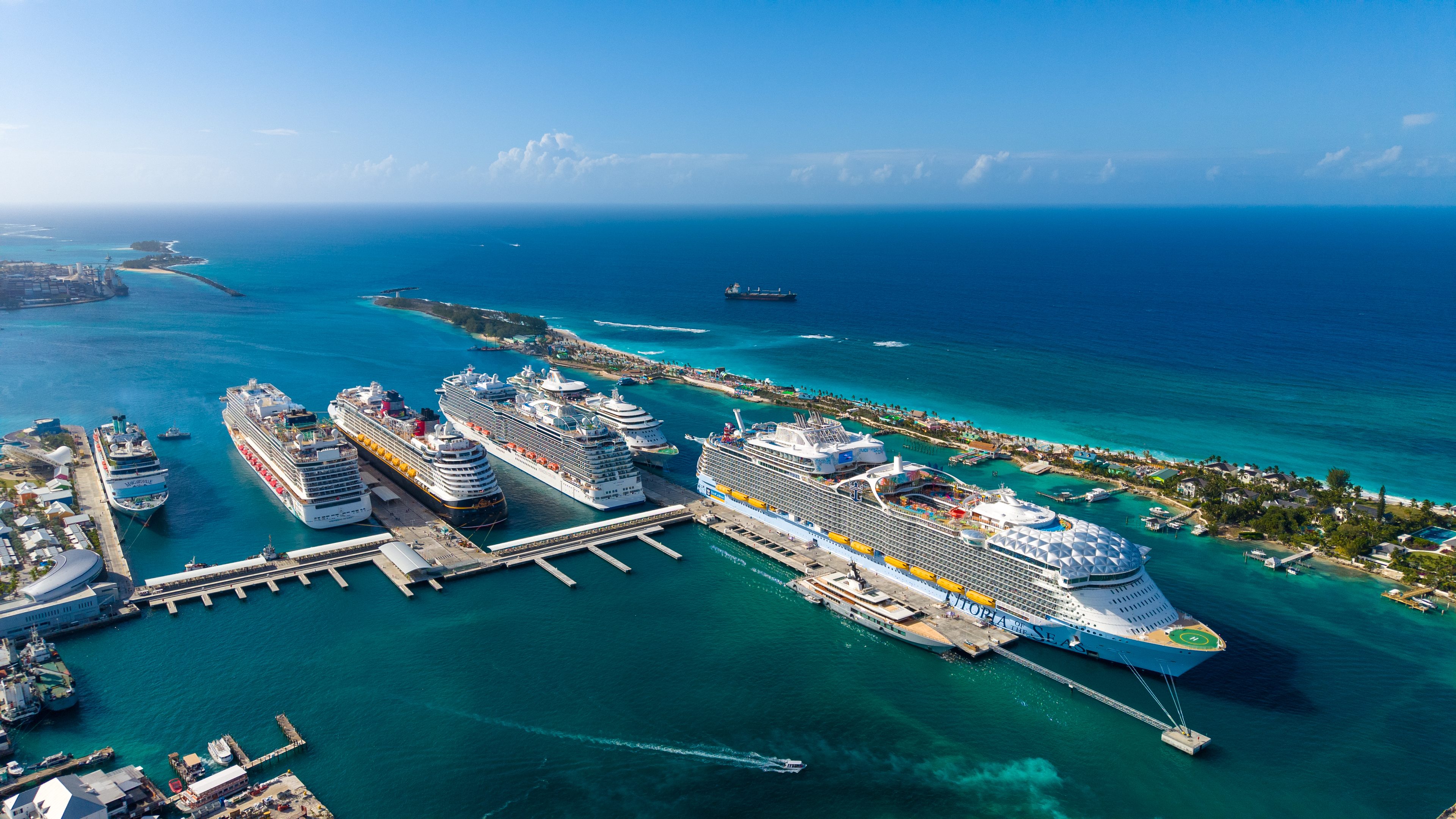 Cruise ships docked at Nassau Cruise Port, with Paradise Island and the Atlantis bridge behind