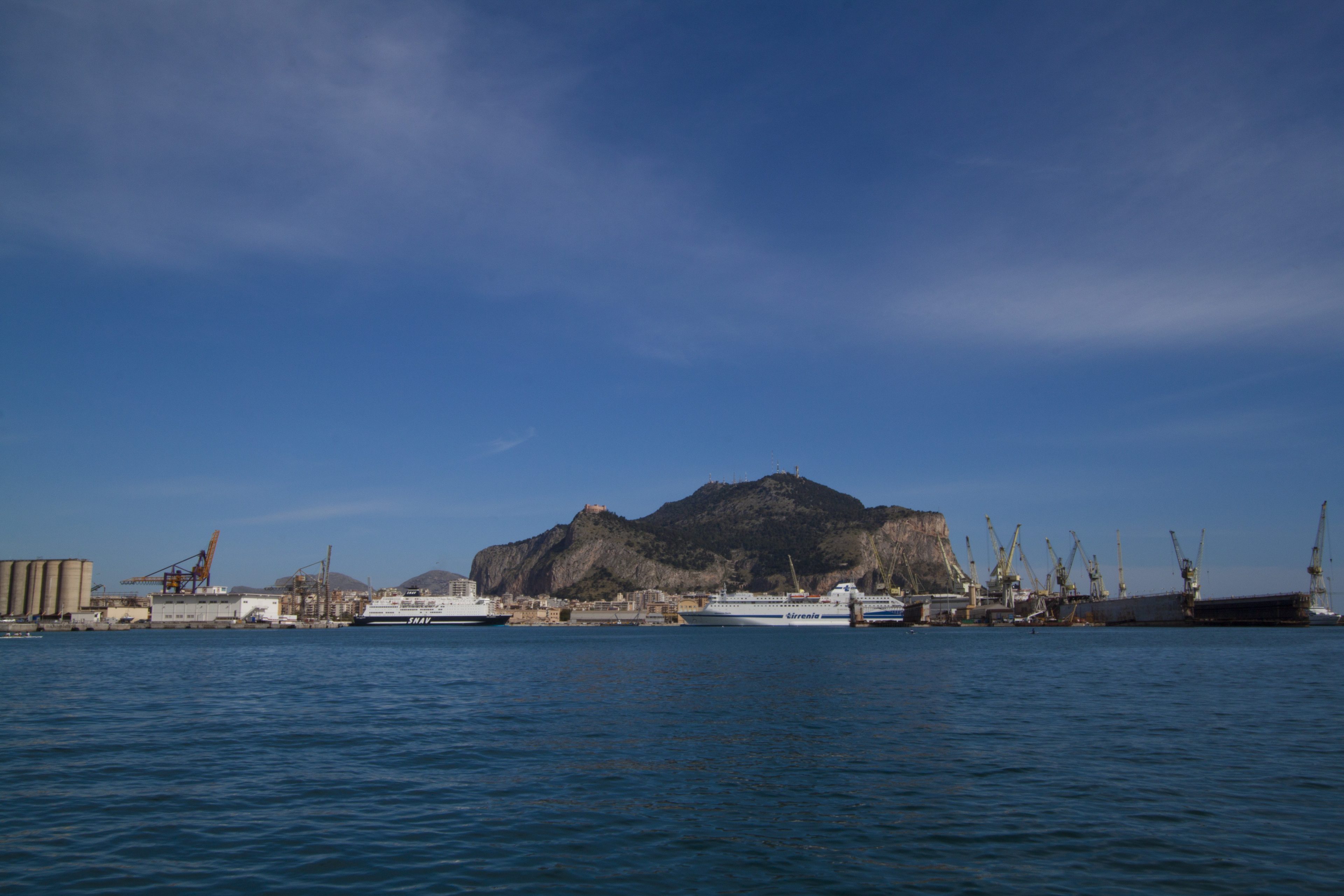 Palermo seen from the gulf, with the port cranes and Monte Pellegrino behind