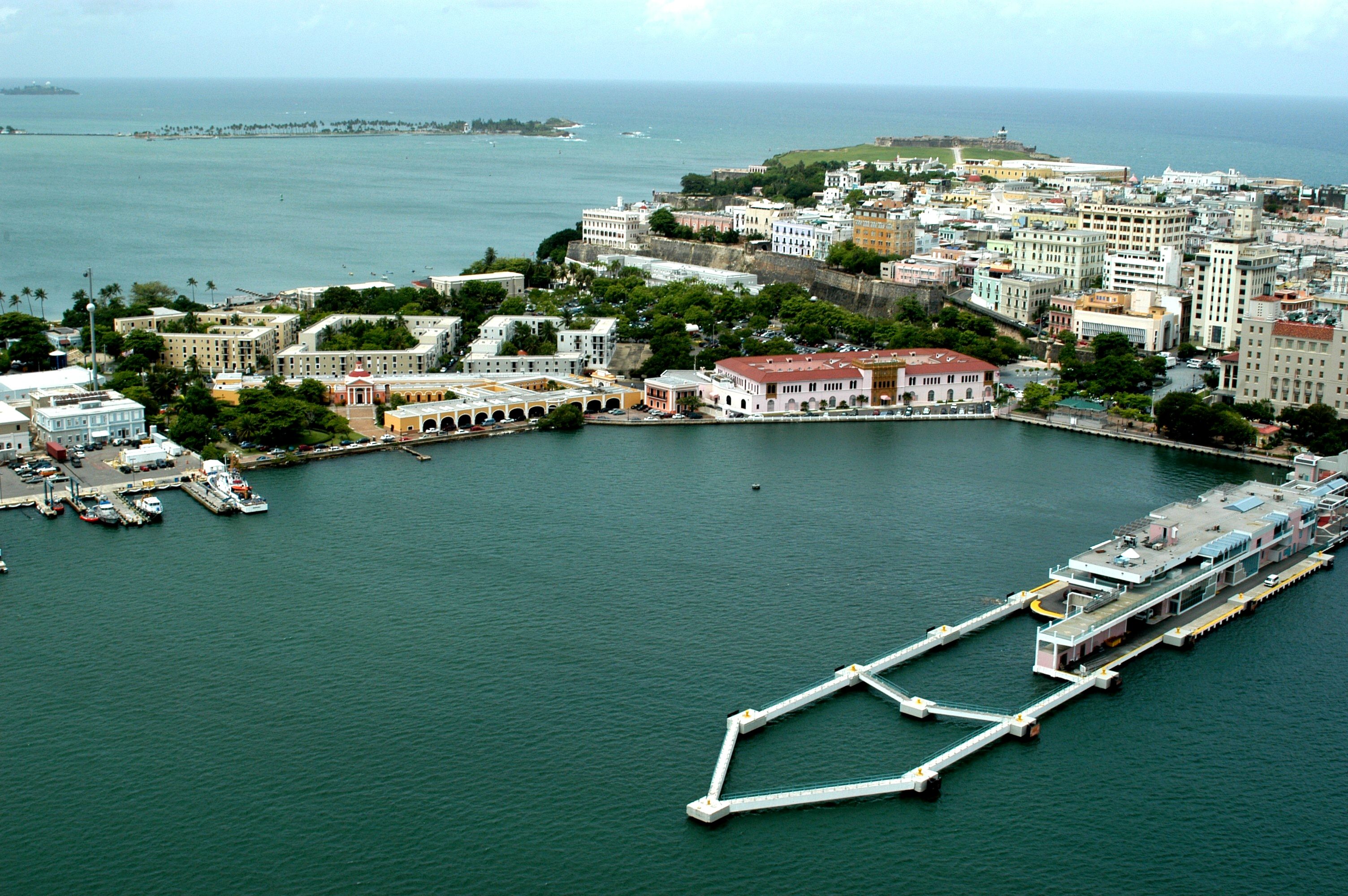 Aerial view of the western end of Old San Juan from the bay, with a cruise pier beside it