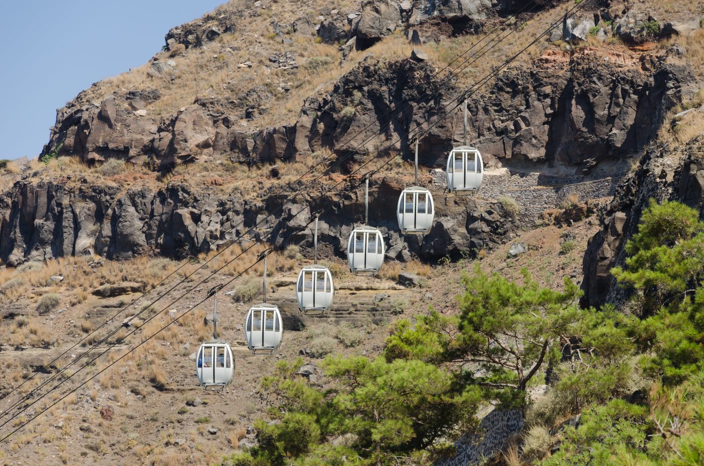 Cable car gondolas on the cliff between Fira Bay and Fira