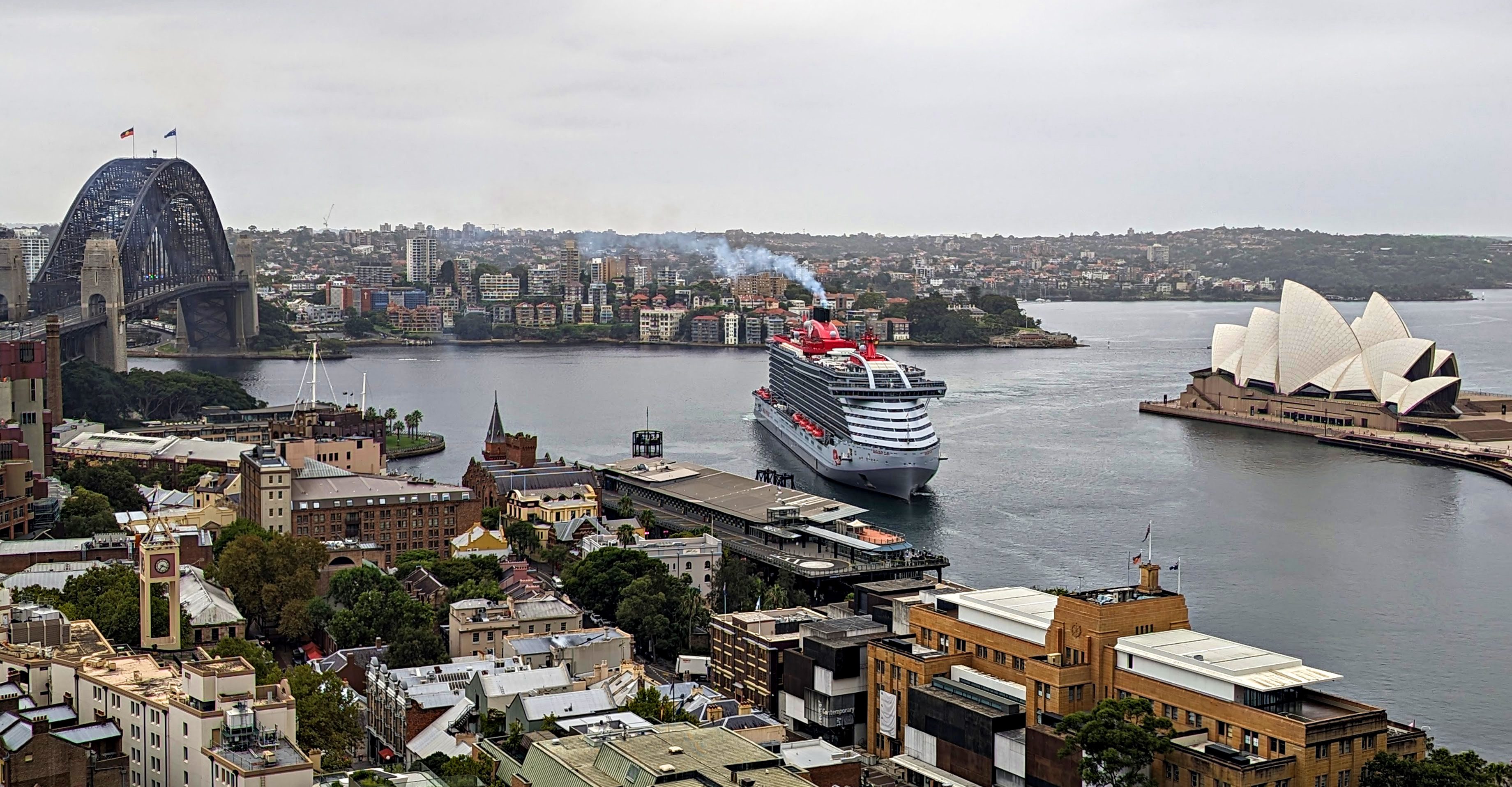 A cruise ship at the Overseas Passenger Terminal with the Harbour Bridge and Opera House beside it