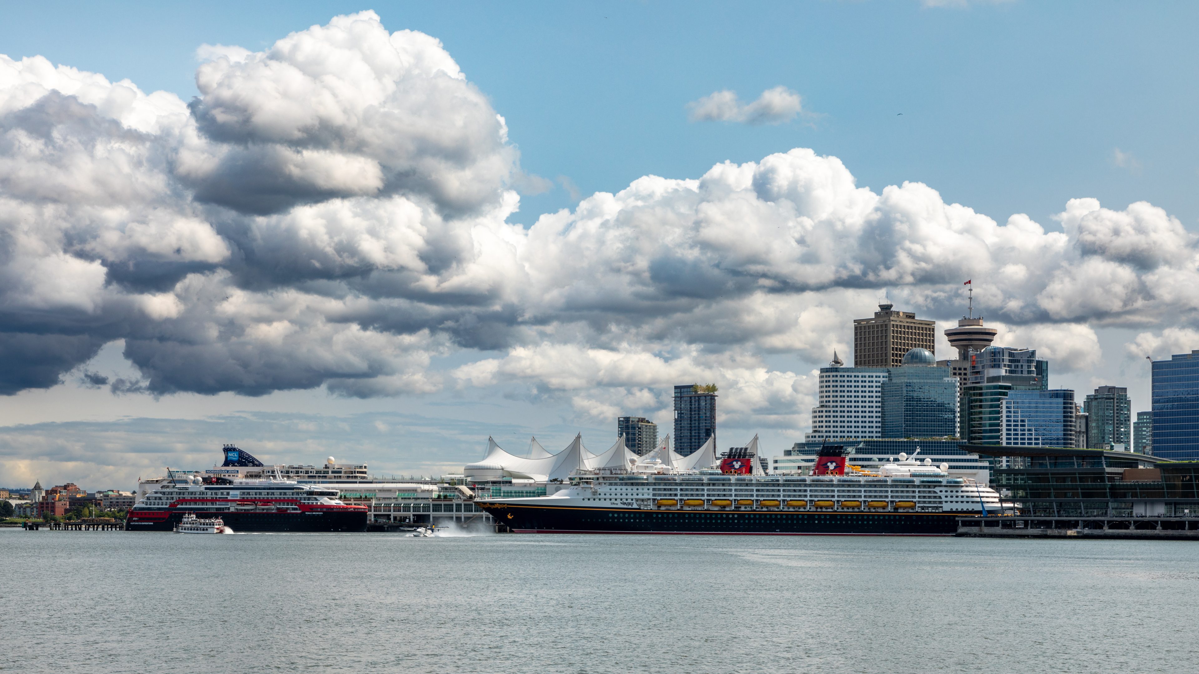 Cruise ships alongside Canada Place in Vancouver, seen from the water